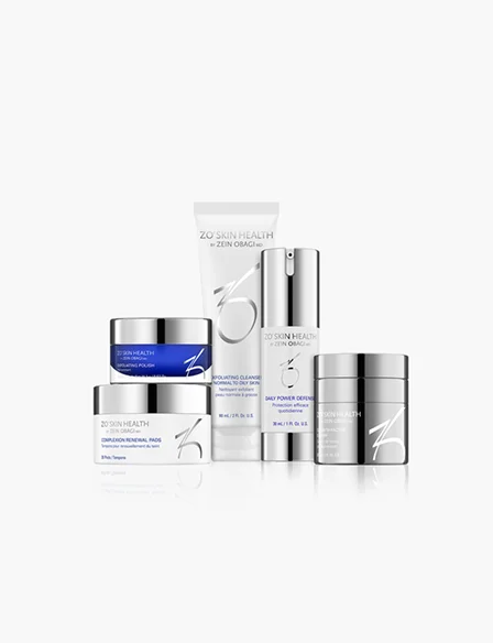 A professional group shot of various ZO Skin Health skincare products, including cleansers, polishes, and renewal pads, arranged against a plain white background. - Skincare in Los Angeles, CA