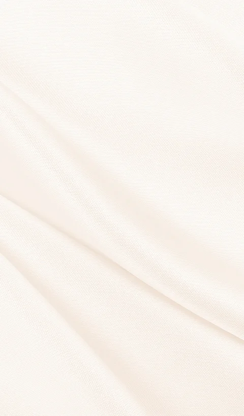 A minimalist background image featuring the soft, elegant folds of a smooth cream-colored fabric with subtle diagonal shadows. - In Los Angeles, CA